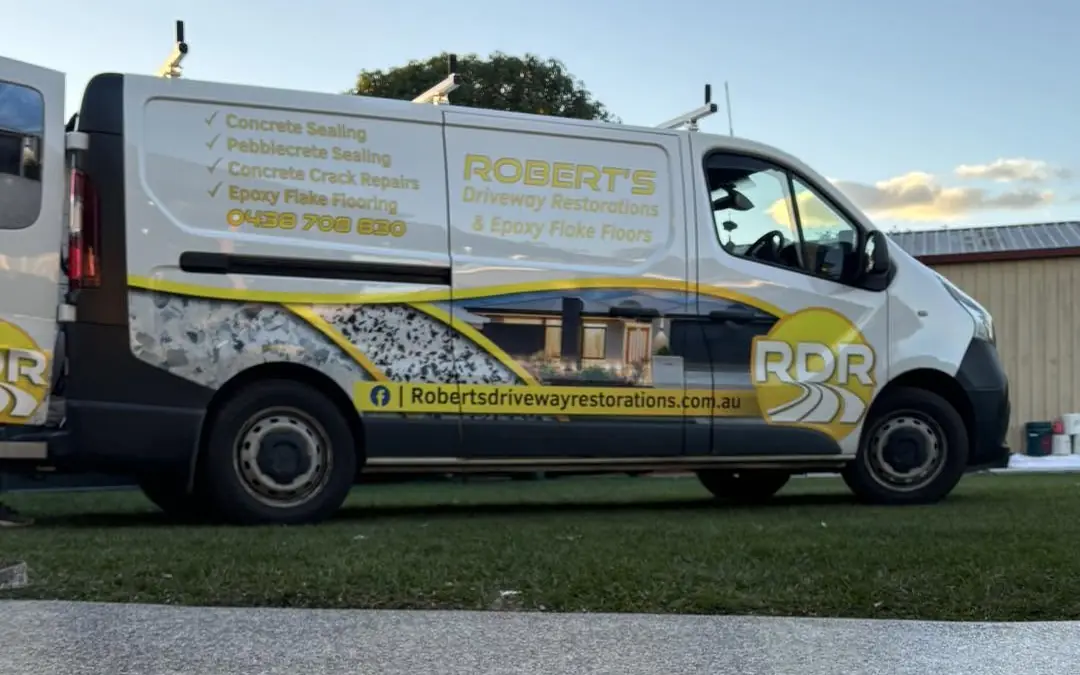 The white Robert's Driveway Restorations van, signwritten in yellow with the RDR logo, parked beyond a speckled flake path